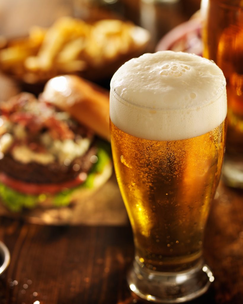beer with hamburgers on restaurant table